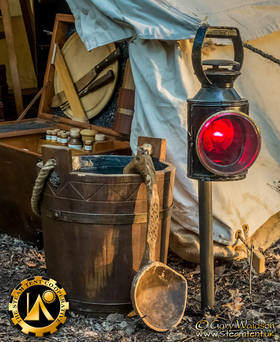 A Fire Bucket placed near the entrance of a tent.  The Steam Tent Co-operative. © Gary Waidson - www.Steamtent.uk